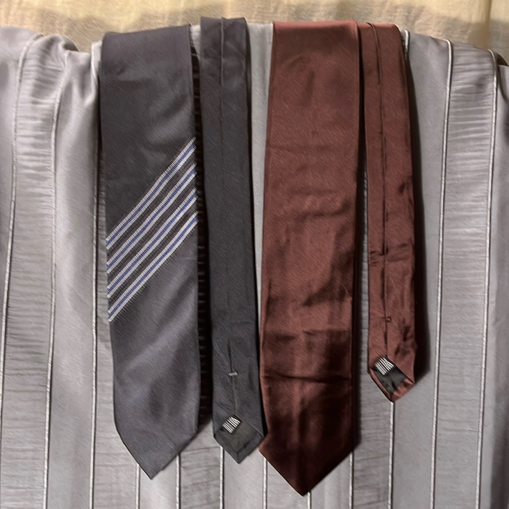 Two Lanvin silk ties, one solid maroon, one blue and white stripe on black.